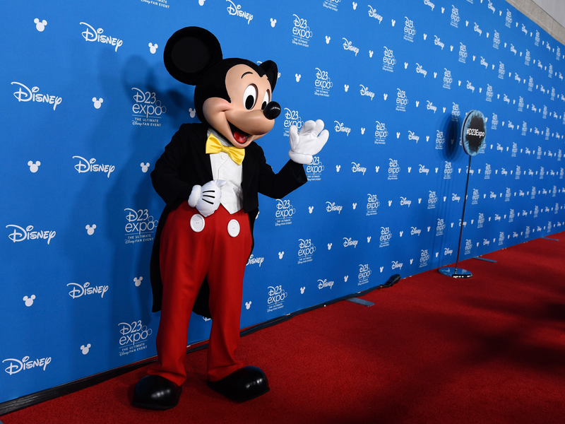 Mickey Mouse waves to members of the media at the Disney Legends press line during the 2019 D23 Expo, Friday, Aug. 23, 2019, in Anaheim, Calif. (Photo by Chris Pizzello/Invision/AP)